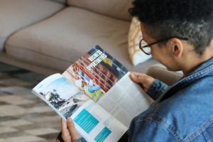 person looking at brochure